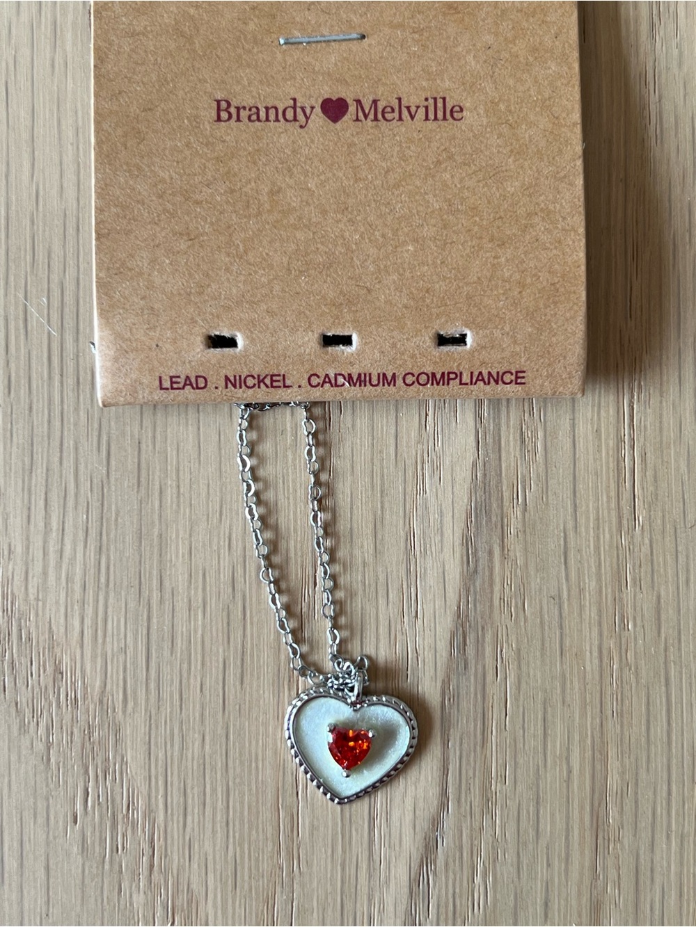 Brandy Melville Silver Heart Necklace with Orange-Red Crystal